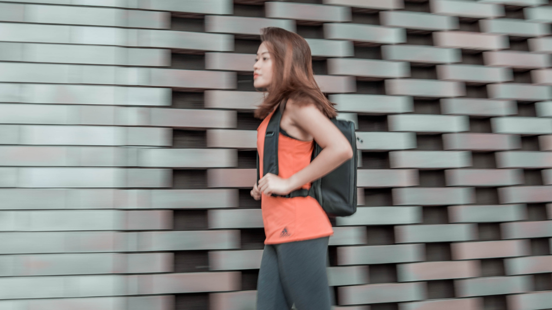 Girl carrying Quiver backpack by The Bold Company
